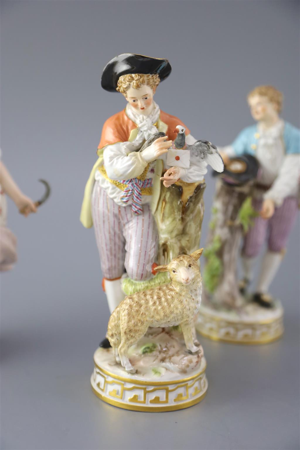 Three Meissen porcelain figures, late 19th century, 18cm - 19cm high